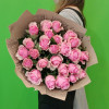 A bouquet of pink roses in craft